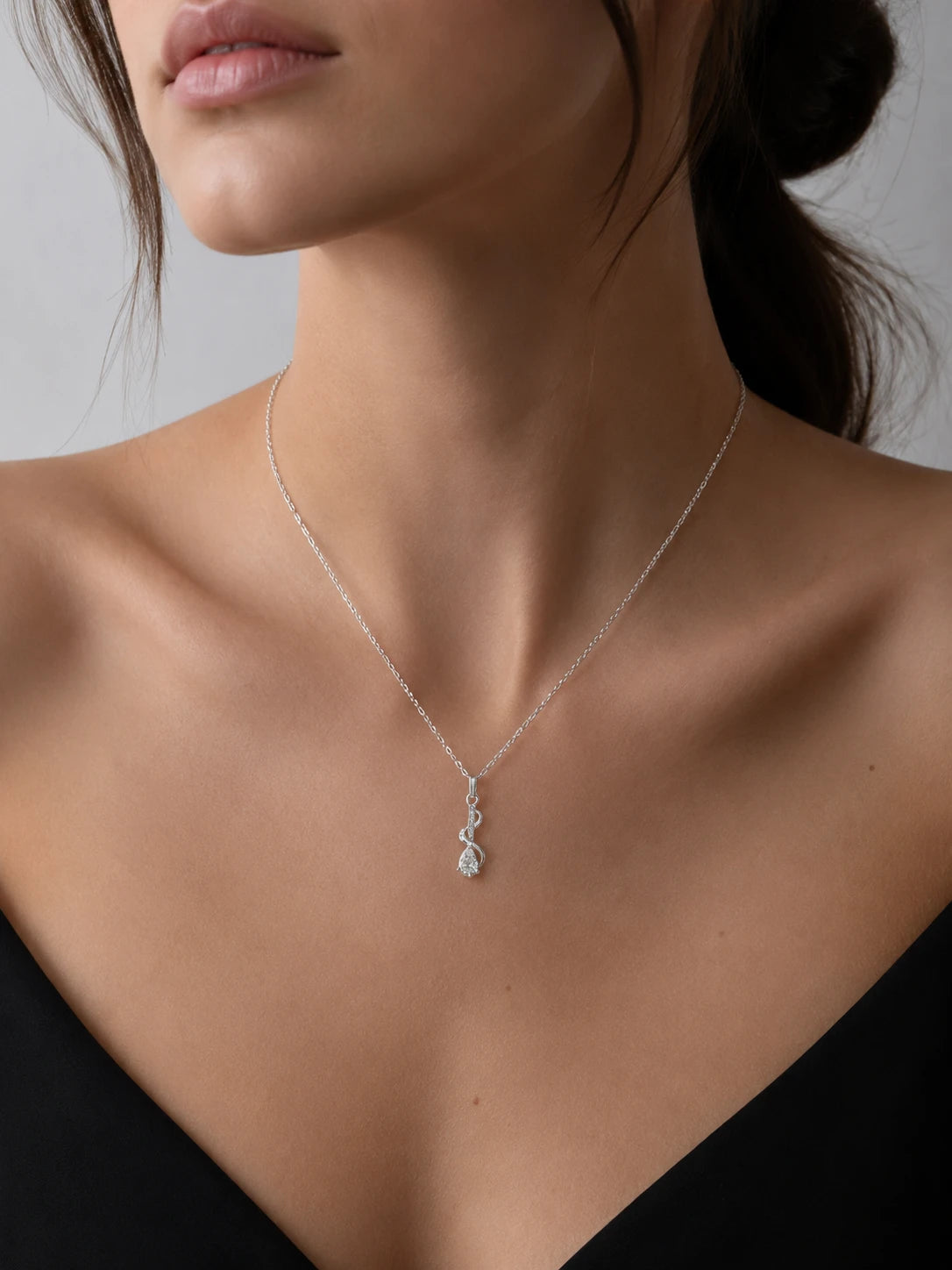 Necklace with a pendant worn by a model against a neutral background SK Jewellers