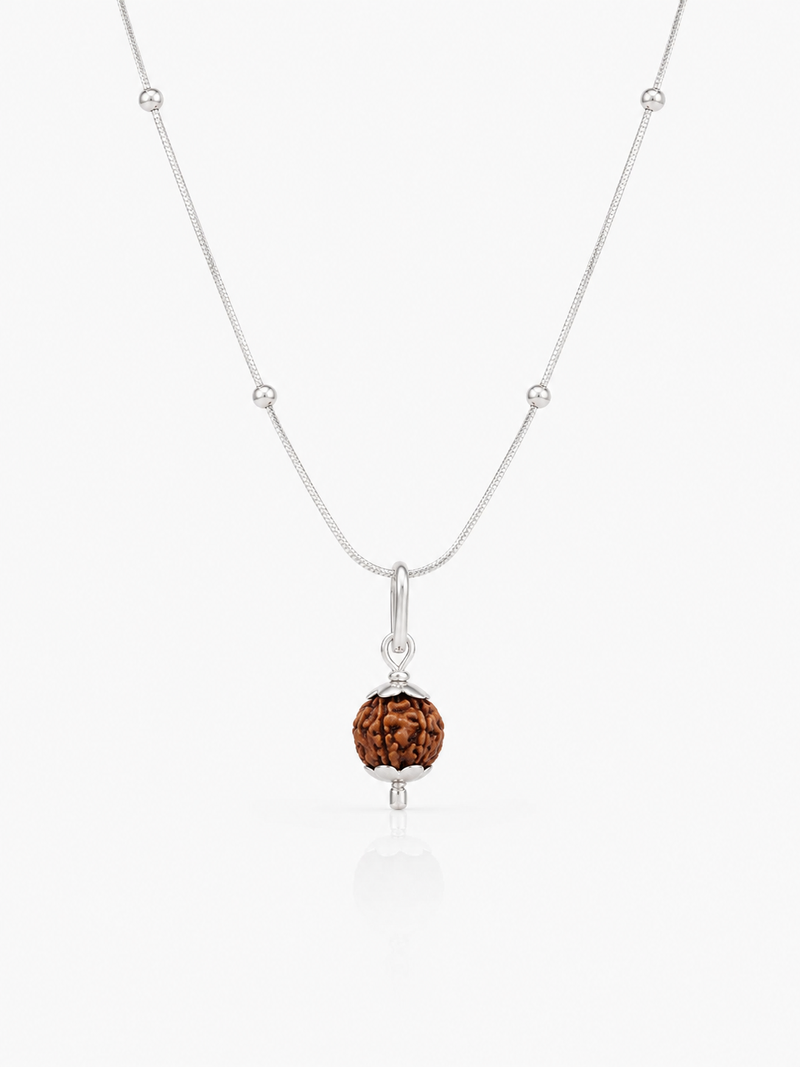 A delicate silver chain necklace featuring a small silver beaded segment along the chain and a central pendant with a faceted brown gemstone in a silver bezel setting, displayed on a clean white background.