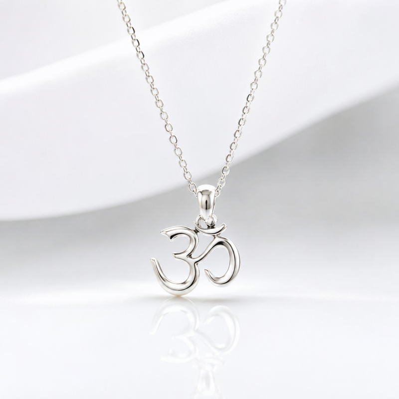 Silver Om symbol necklace on a white background