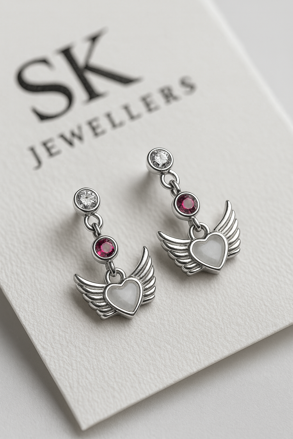 Wings of Serenity: Heartfelt Oxidised Silver Winged Earrings